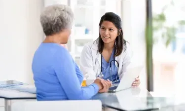 Family Nurse Practitioner with MSN Speaking with Patient