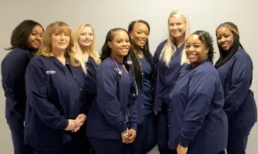 Herzing medical assistant students gather to pose for a group photo