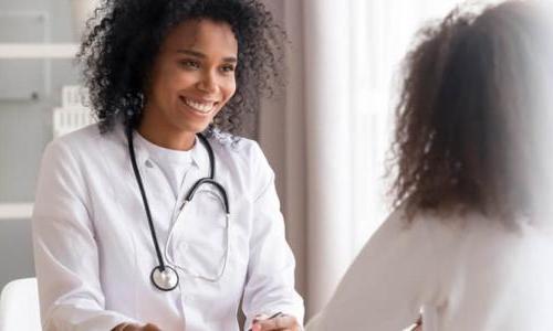 Mental health nurse smiling and engaging with a patient